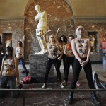 Femen activists demonstrate in the Louvre03